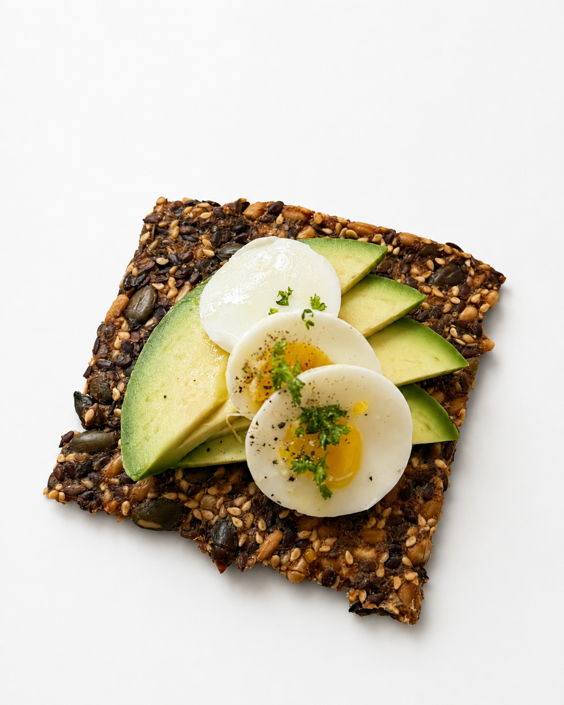 Cracker with avocado and egg
